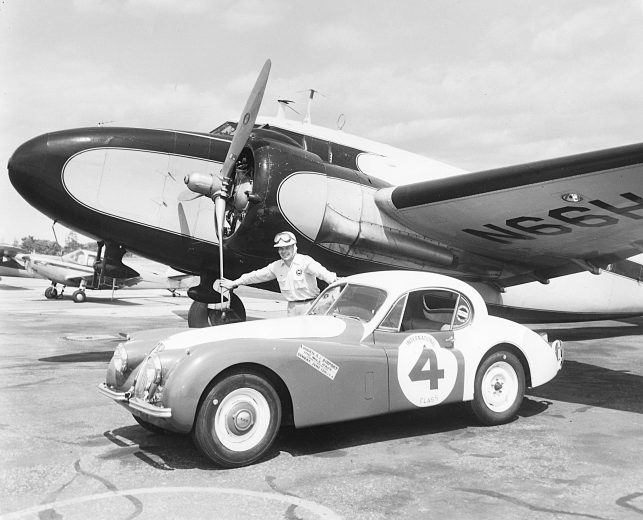 Al Keller poses next to No. 4 car at the airport.