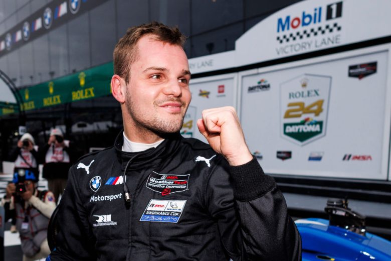 Dries Vanthoor celebrates after winning the pole for the Rolex 24 at Daytona.