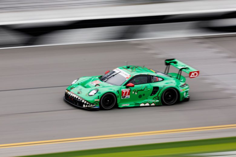 The No. 77 AO Racing Porsche drives at Daytona.