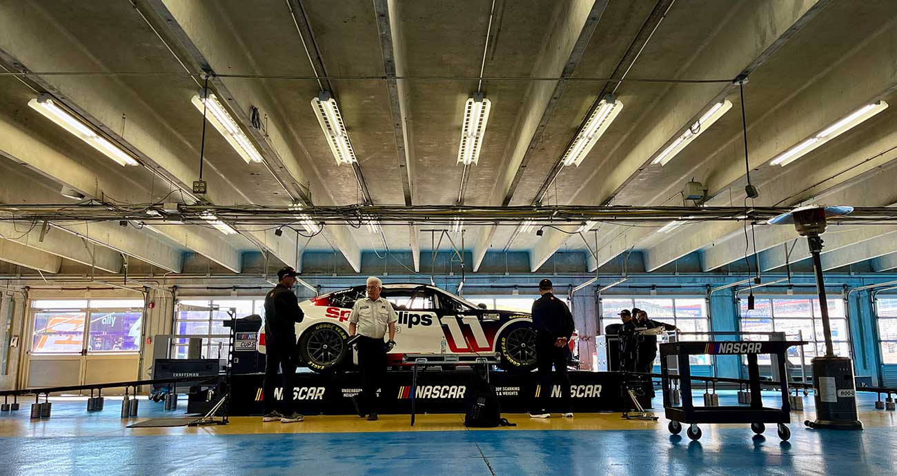 The No. 11 Toyota for Denny Hamlin rolls through Cup Series inspection at Charlotte Motor Speedway