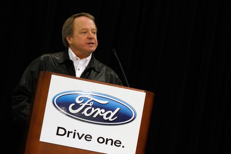 Edsel Ford II speaks to media at podium onstage.
