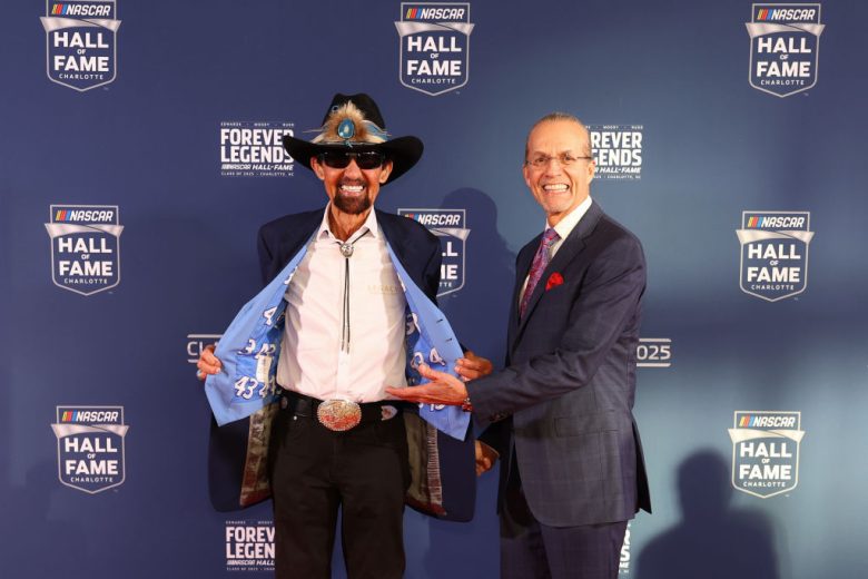 Richard Petty and Kyle Petty pose for a photo at the NASCAR Hall of Fame.