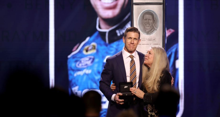 Carl Edwards and his mother share a special moment at the NASCAR Hall of Fame.
