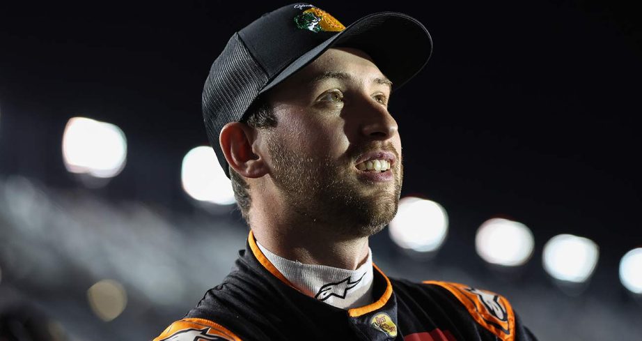 Chase Briscoe watches Cup Series qualifying from the Daytona grid.