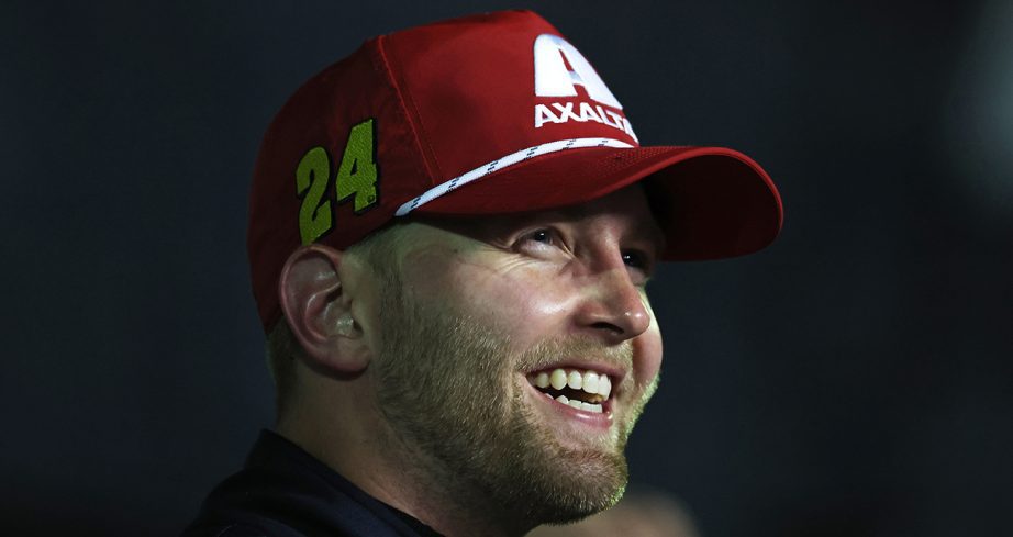 William Byron smiles and looks on.