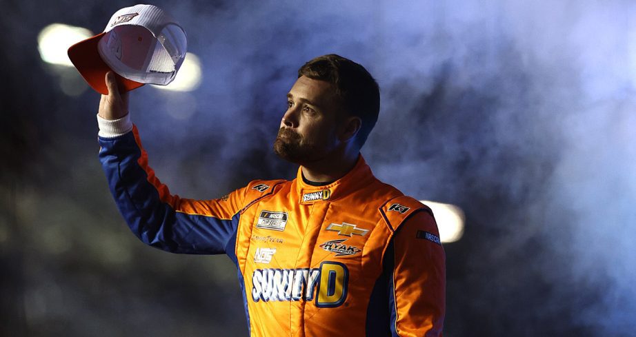 Ricky Stenhouse Jr. waves to fans before a NASCAR Cup Series race.