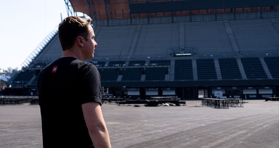 Christopher Bell looks up at the stadium seats.