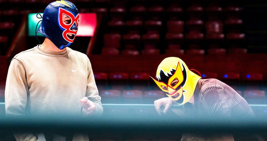 Ryan Blaney and Chase Elliott wear luchador mask and wrestle .
