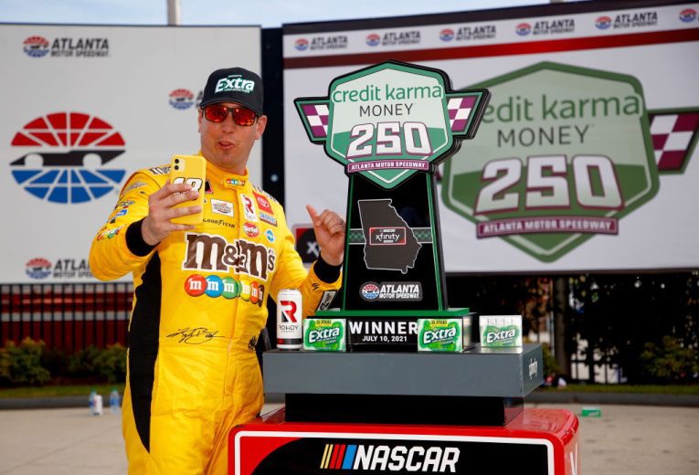 Kyle Busch takes a selfie in Victory Lane at Atlanta Motor Speedway following a NASCAR Xfinity Series win.