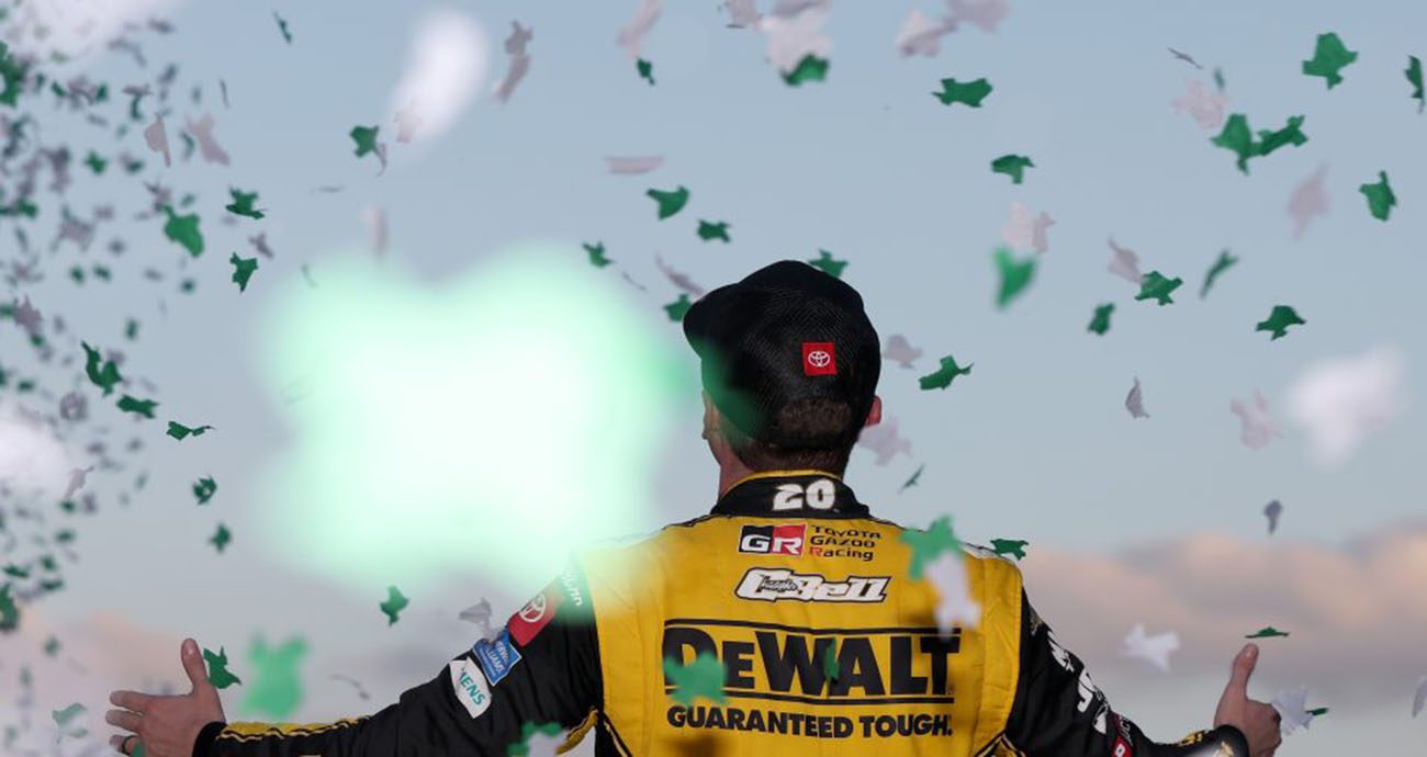 Christopher Bell celebrates as confetti falls in Victory Lane.