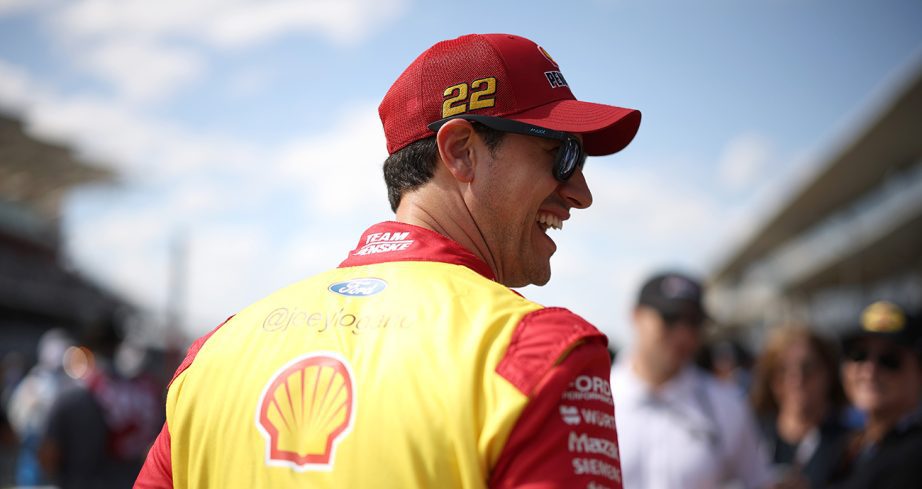joey logano smiles with fans
