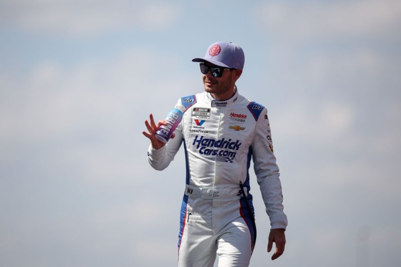 Kyle Larson waves to the crowd.