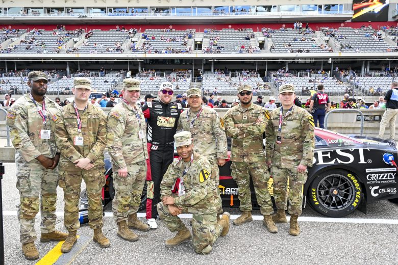 Ty Dillon poses for a photo with members of the United States Armed Forces at Circuit of The Americas.