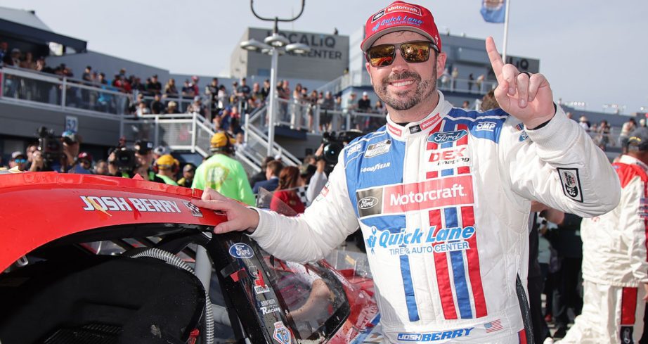 Josh Berry poses for a photo after placing the winner sticker on his No. 21 Wood Brothers Racing Ford in Victory Lane at Las Vegas Motor Speedway.