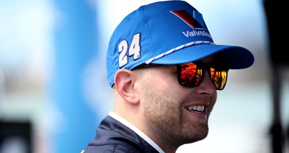 William Byron looks on and smiles.