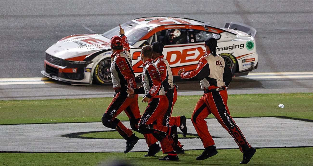 The pit crew of the No. 21 DEX Imaging Ford, celebrates after Harrison Burton wins the NASCAR Cup Series Coke Zero Sugar 400 at Daytona International Speedway on Aug. 24, 2024 in Daytona Beach, Florida. 