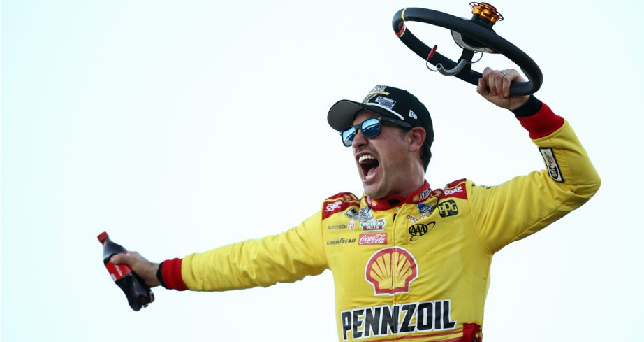 Joey Logano, driver of the No. 22 Shell Pennzoil Ford, celebrates in Victory Lane after winning the NASCAR Cup Series Championship Race at Phoenix Raceway.