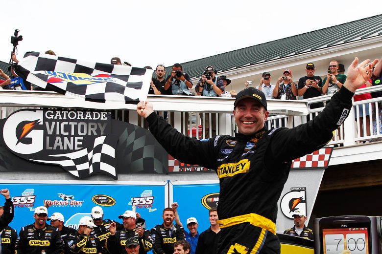 Marcus Ambros celebrates in Victory Lane.