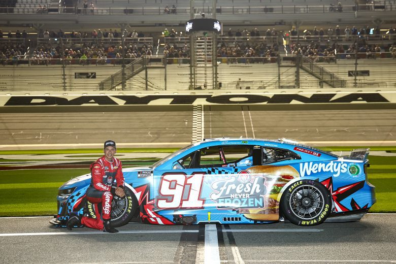 Heilo Castroneves poses next to No. 91 Trackhouse Wendy's car.