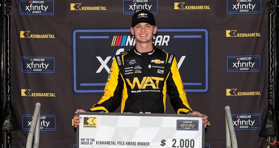 Jesse Love celebrates after winning the pole at Talladega.