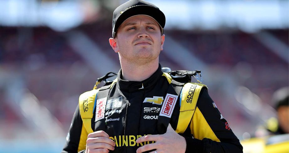 Justin Haley looks on as he waits on the Cup Series grid at Phoenix Raceway