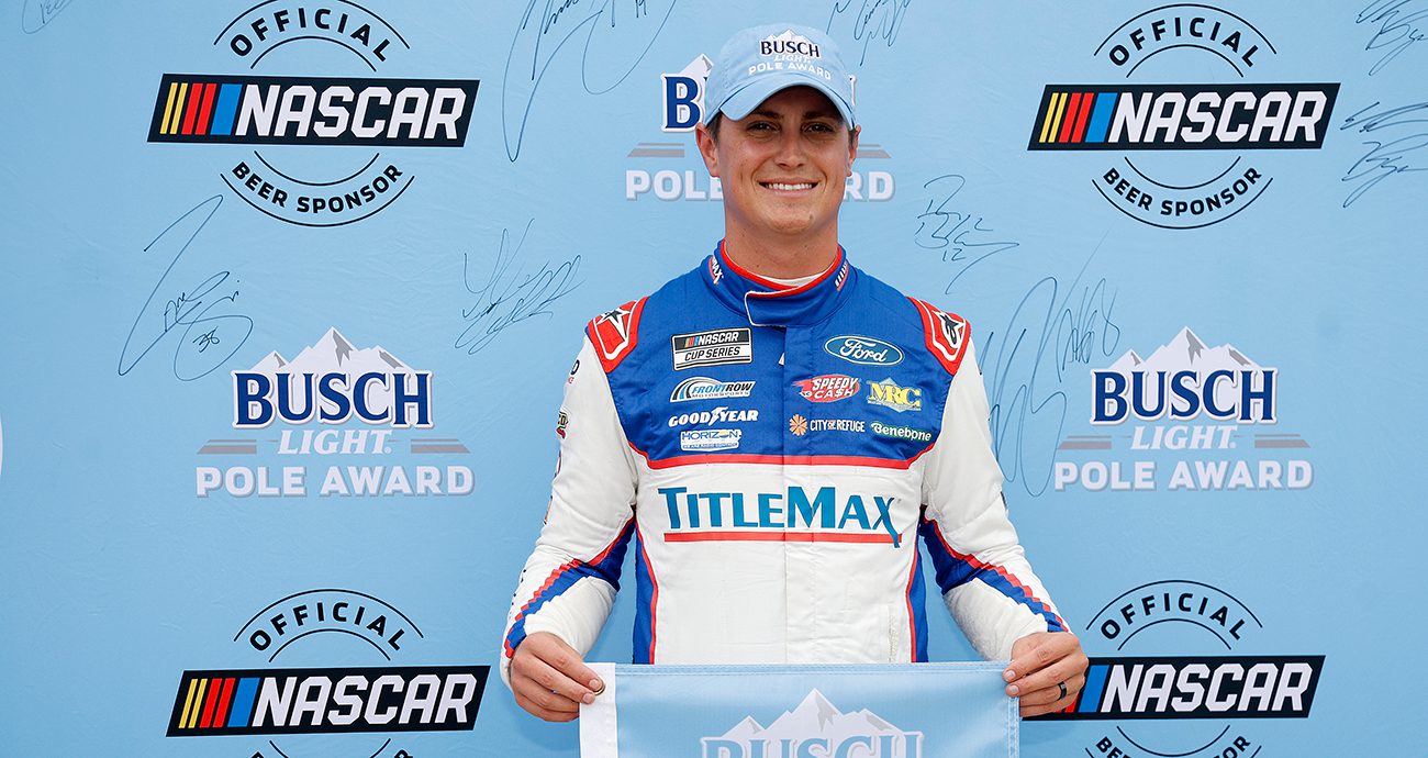 Zane Smith poses for a photo following his pole award victory at Talladega Superspeedway.