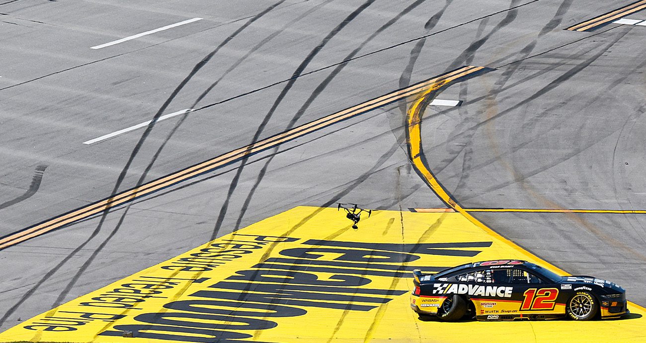 Ryan Blaney drives to pit road at Talladega Superspeedway.
