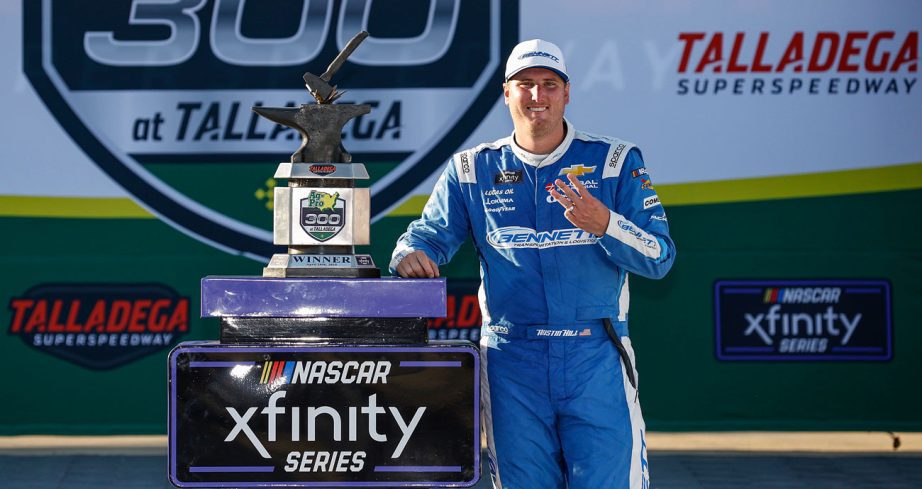 Austin Hill poses for a photo in Victory Lane following his NASCAR Xfinity Series win at Talladega Superspeedway.