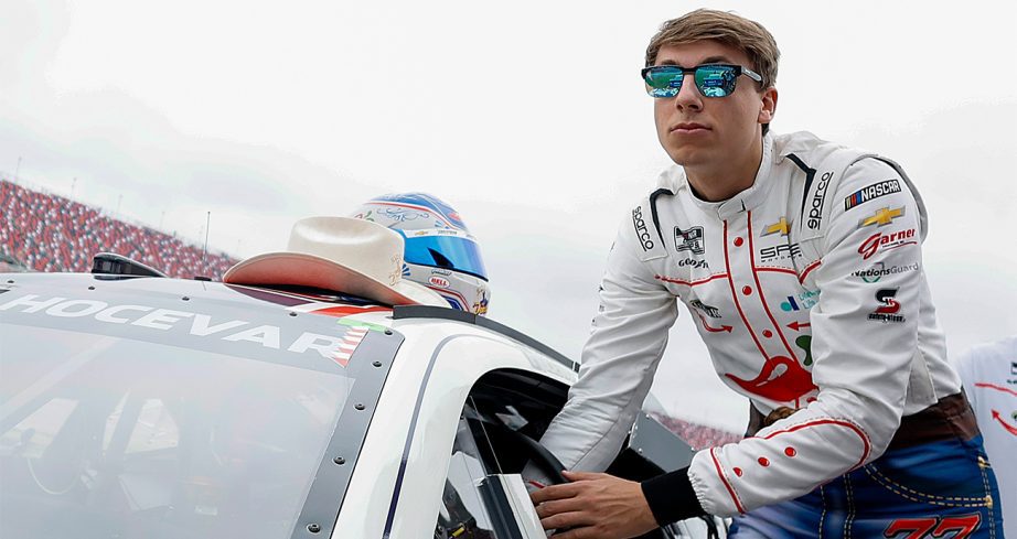 carson hocevar walks on the grid with his car