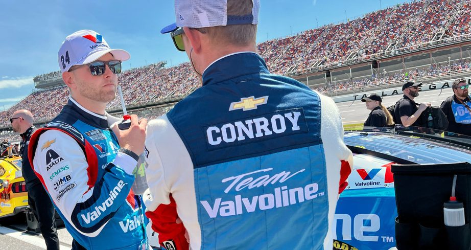William Byron looks on.