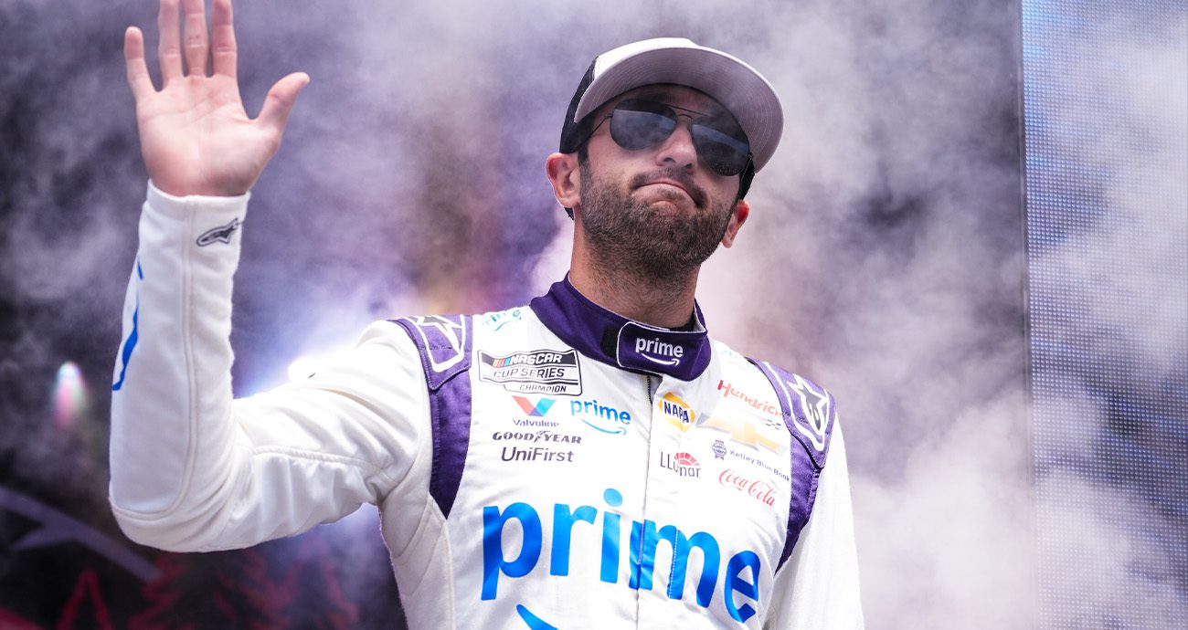 Chase Elliott waves to fans during driver intros at Talladega Superspeedway.