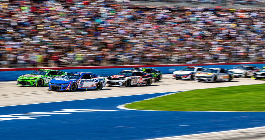 View of NASCAR Cup cars racing at Texas Motor Speedway