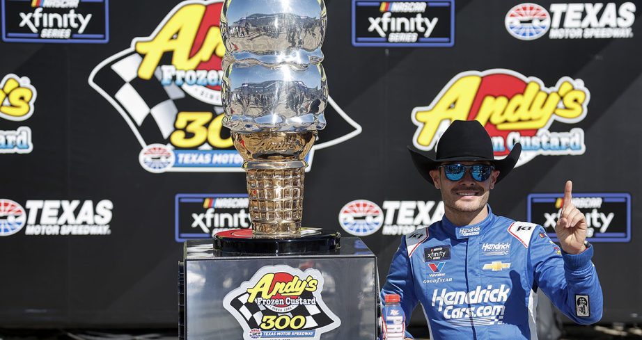 Kyle Larson poses with trophy in Victory Lane.