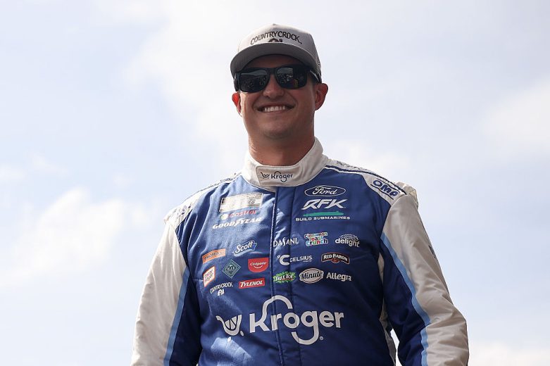 Ryan Preece looks on.