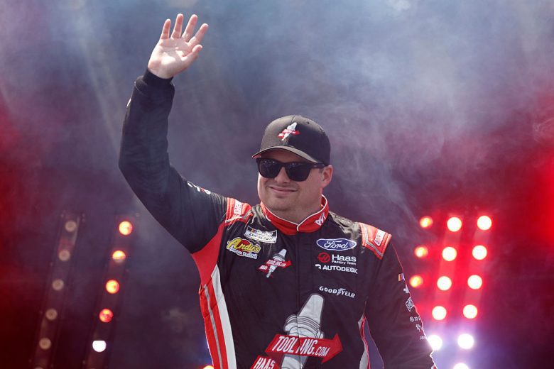 Cole Custer waves to fans.