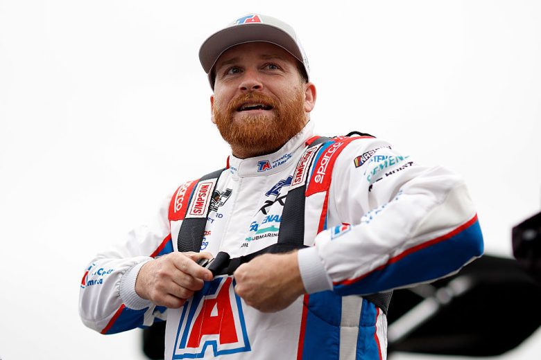 Chris Buescher looks on.
