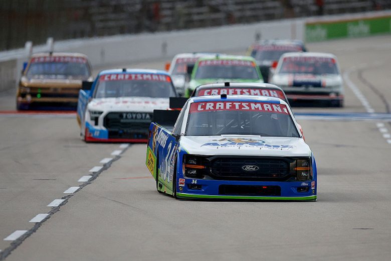 Layne Riggs drives at Texas.
