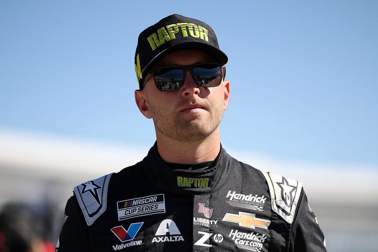 William Byron looks on.