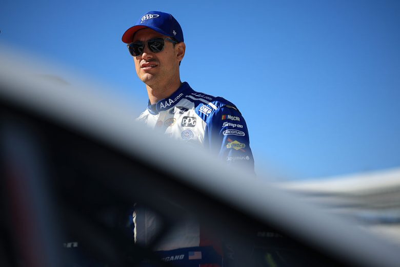 Joey Logano looks on.