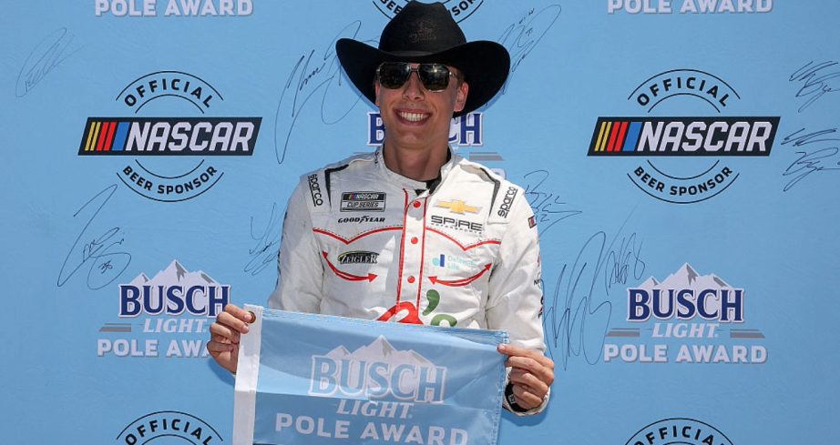 Carson Hocevar celebrates after winning the pole at Texas.