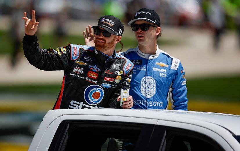 Jeb Burton and Jesse Love waves to fans at Texas.