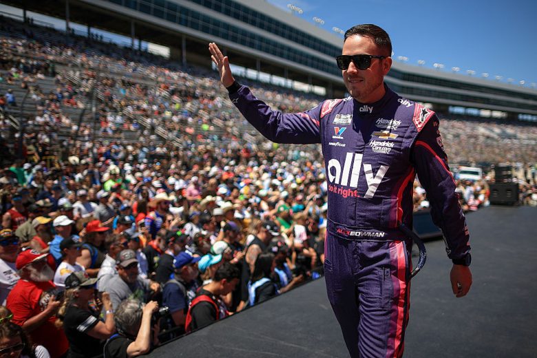 Alex Bowman waves to fans.