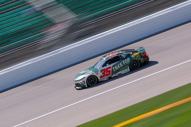 Riley Herbst drives at Kansas.