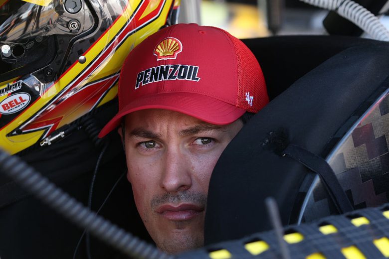 Joey Logano looks on at Kansas.