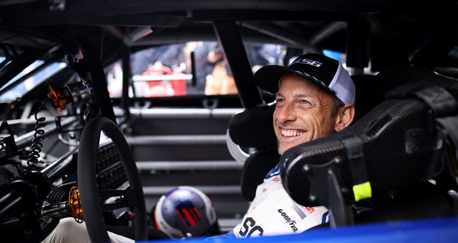 Jensen Button smiles from the driver seat of the Garage 56 Camaro.