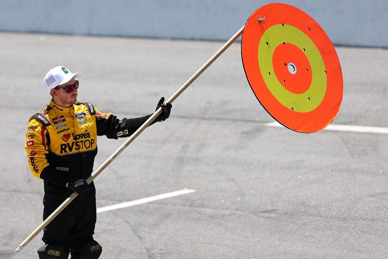A pit crew member holds a sign at North Wilkesboro.