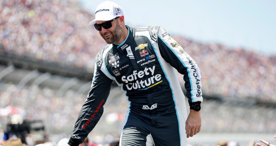 Shane van Gisbergen greets fans before a NASCAR Cup Series race.