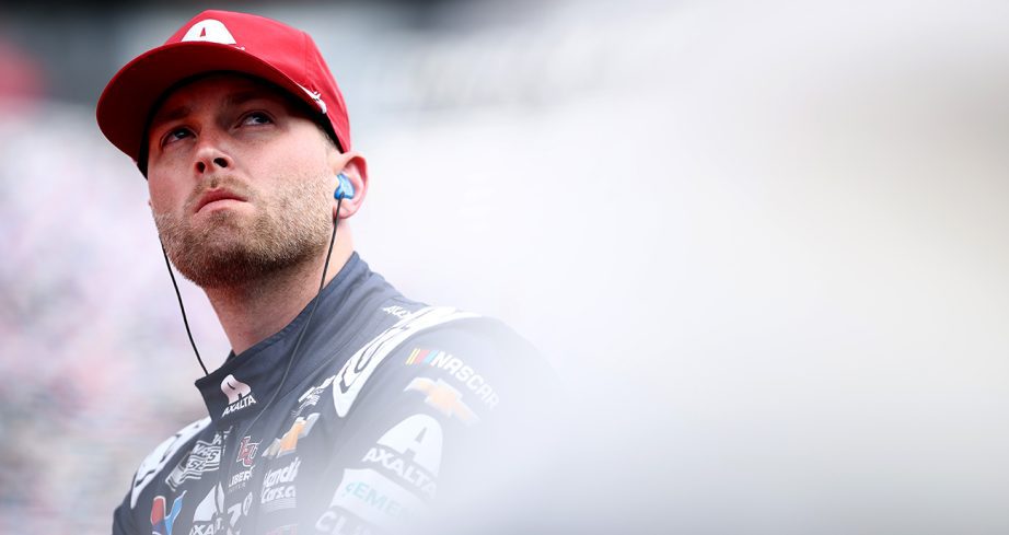 William Byron looks on.