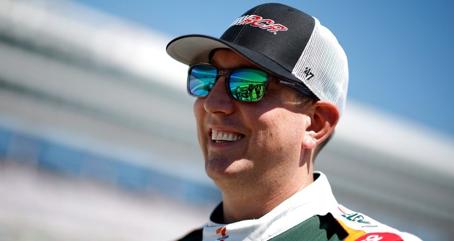 Kyle Busch smiles before a NASCAR Cup Series session.