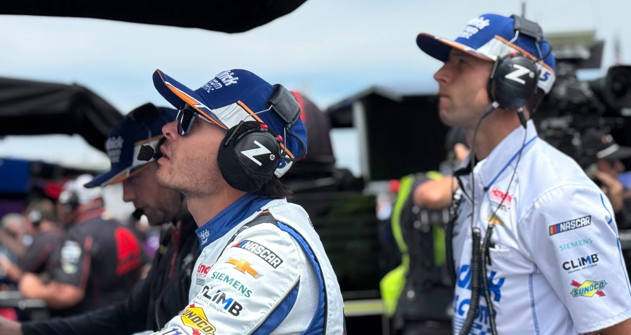 Kyle Larson and crew chief Cliff Daniels look on during NASCAR Cup Series practice.